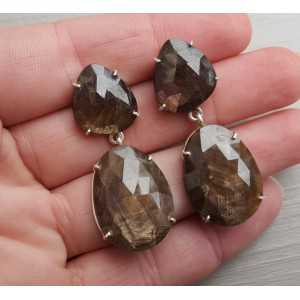 Silver earrings set with brown Sapphires