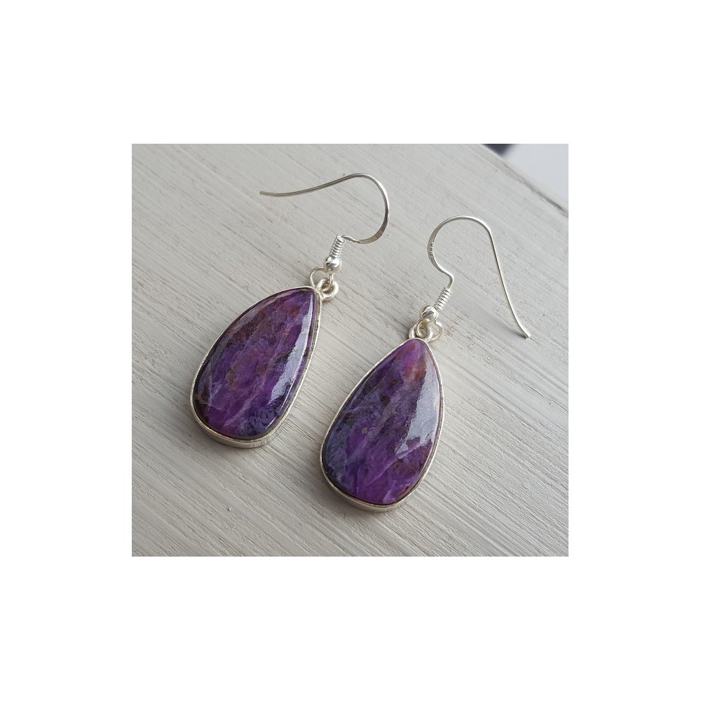 Silver earrings set with Sugiliet