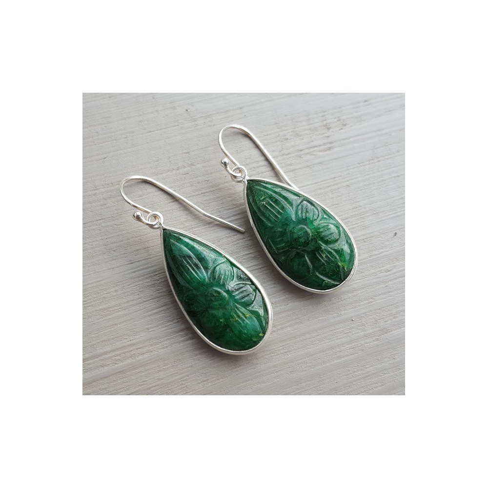 Silver earrings with carved Emerald