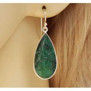Silver earrings with carved Emerald