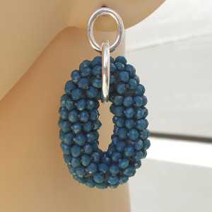 Silver earrings with jeans blue oval-shaped pendant of crystals