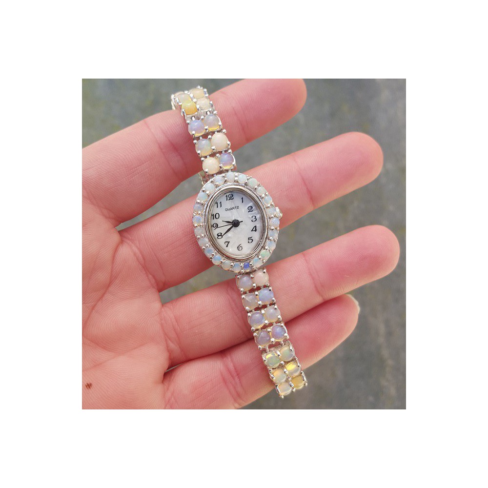 Silver watch set with round cabochon Ethiopian Opals