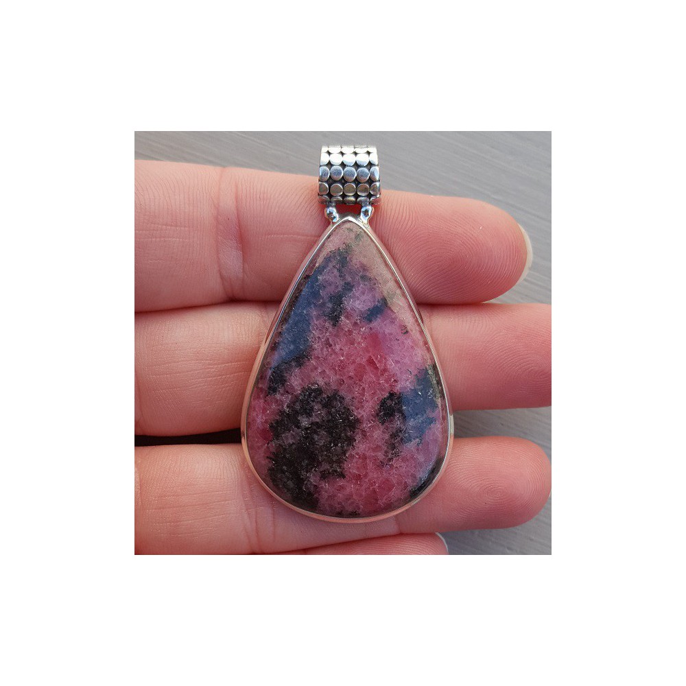 Silver pendant with drop-shaped cabochon cut Rhodonite