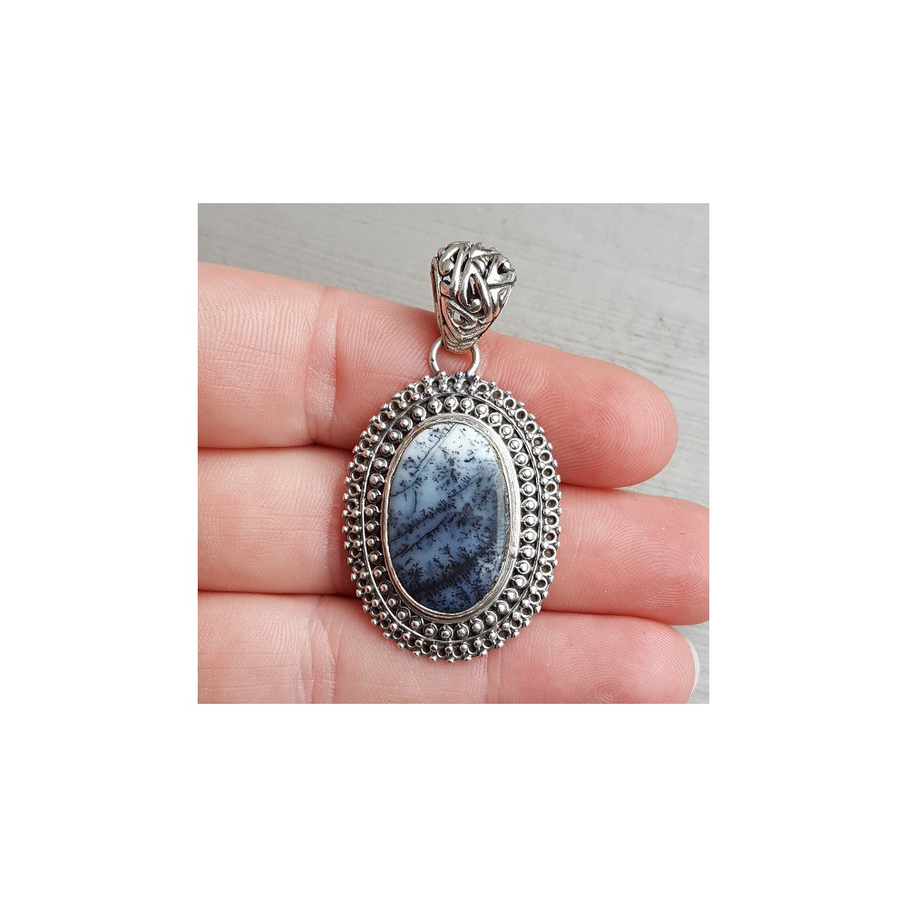 Silver pendant oval Dendrite Opal set in a carved setting